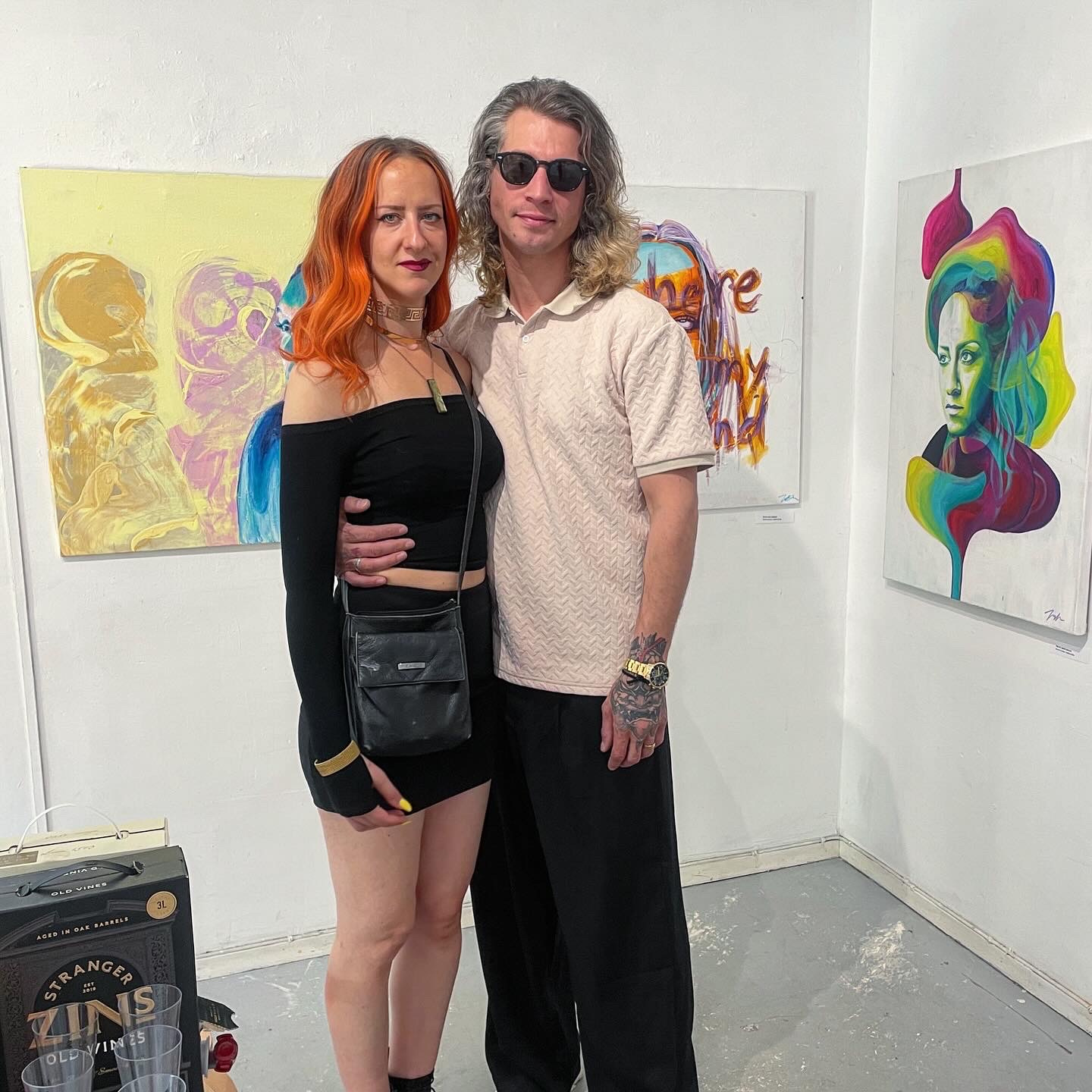 people watching painting on isabelle de brito and isabel backman cashmans exhibition standing in front of painting